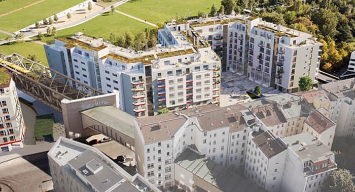 Aerial shot of new build real estate project "Wohnpanorama" in Berlin-Kreuzberg, showing the condominiums in context with the surrounding neighbourhood and Gleisdreieck park.