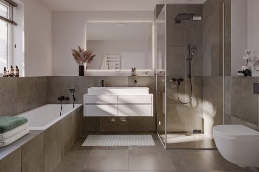 Ein modernes Bad mit bodentiefen Duschen, großen Fliesen und formschönen Sanitärobjekten gehört zu den klaren Pluspunkten für den Neubaukauf.