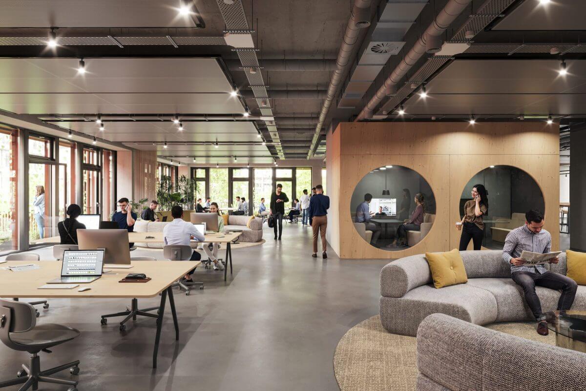 Ein moderner Co-Working-Space im Mixed-Use-Quartier Sugar Valley mit offenen Arbeitsbereichen, gemütlichen Sitzmöglichkeiten und Besprechungsräumen, umgeben von großen Fenstern mit Blick ins Grüne.